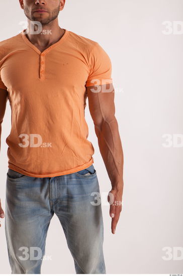 Arm moving pose orange thsirt of bodybuilder Harold
