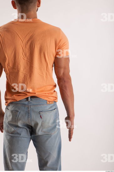Arm moving pose orange thsirt of bodybuilder Harold
