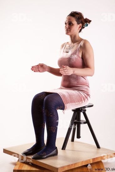 Sitting reference of whole body pink dress purple tights black shoes Nadine