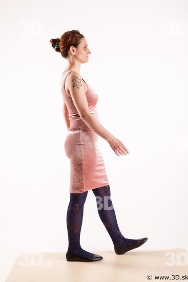 Walking reference of whole body pink dress purple tights black shoes Nadine