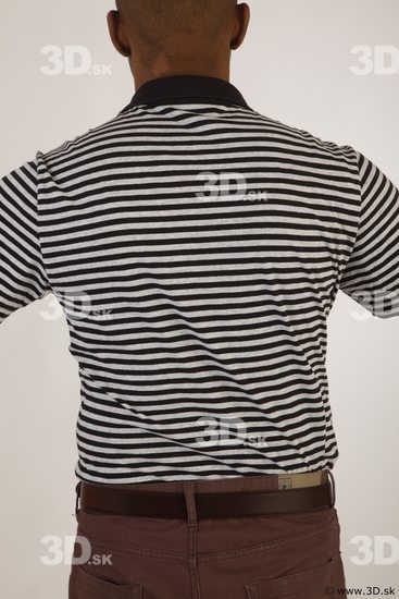 Upper black white striped shirt brown jeans of Arturo