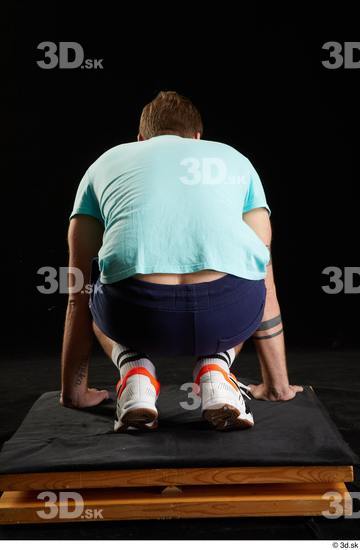 Whole Body Man White Sports Shoes Shirt T shirt Shorts Average Kneeling Studio photo references