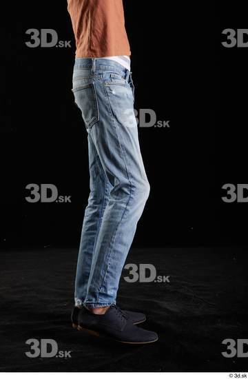 Alessandro Katz  black shoes blue jeans casual flexing leg side view  jpg