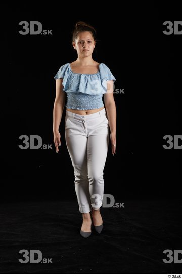 Serina Gomez  blue carmen shirt casual dressed front view grey high heels walking white trousers whole body  jpg