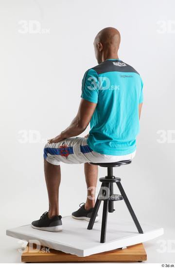 Whole Body Man Black Sports Shirt Shorts Slim Sitting Studio photo references