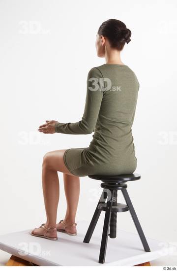 Vanessa Angel  casual dressed green long sleeve dress sitting whole body  jpg