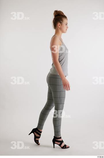 Olivia Sparkle  black high heels sandals casual dressed grey checkered trousers grey tank top side view whole body  jpg