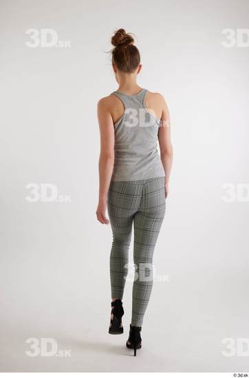 Olivia Sparkle  back view black high heels sandals casual dressed grey checkered trousers grey tank top whole body  jpg