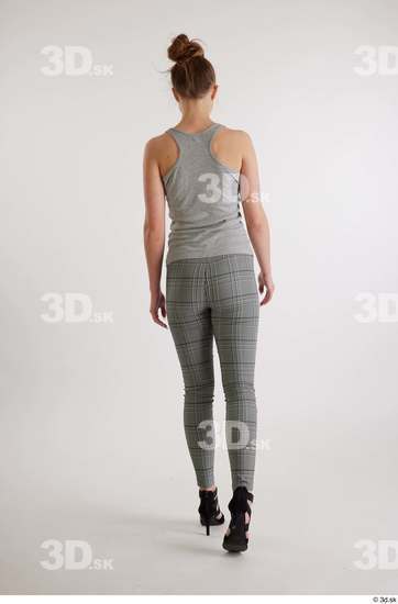 Olivia Sparkle  back view black high heels sandals casual dressed grey checkered trousers grey tank top whole body  jpg