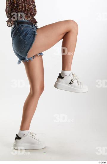 Arina Shy  blue jeans shorts casual dressed leg lower body side view white sneakers  jpg