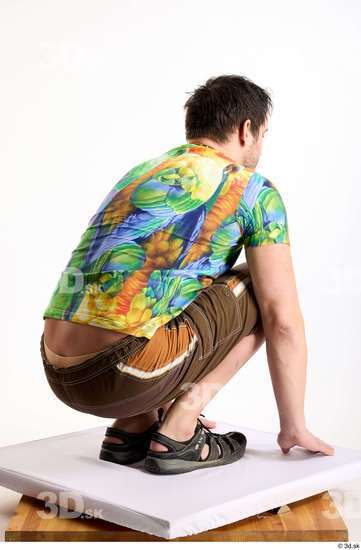 Whole Body Man White Casual Shorts Average Parrot Kneeling Studio photo references