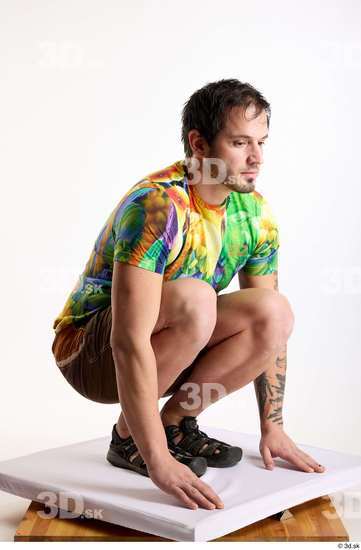 Whole Body Man White Casual Shorts Average Parrot Kneeling Studio photo references