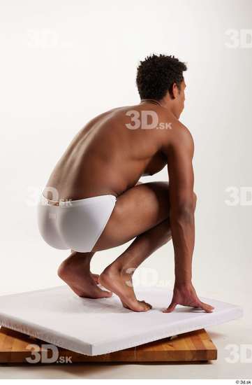 Whole Body Man Black Swimsuit Athletic Kneeling Studio photo references