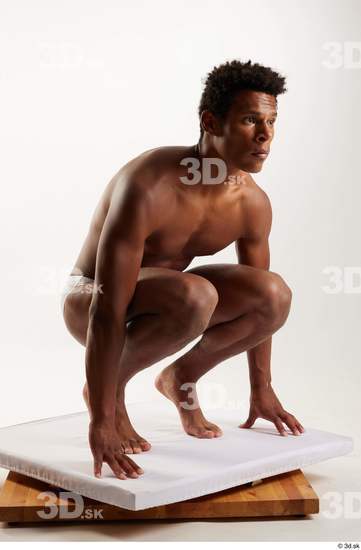 Whole Body Man Black Swimsuit Athletic Kneeling Studio photo references