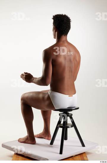 Whole Body Man Black Swimsuit Athletic Sitting Studio photo references