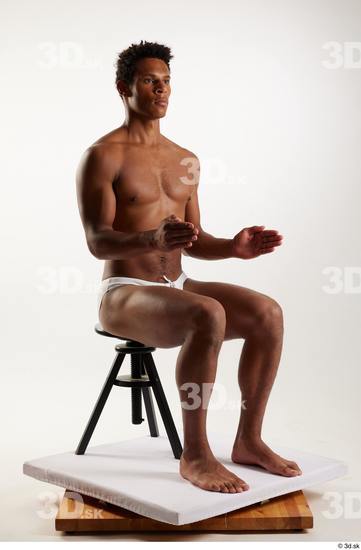 Whole Body Man Black Swimsuit Athletic Sitting Studio photo references