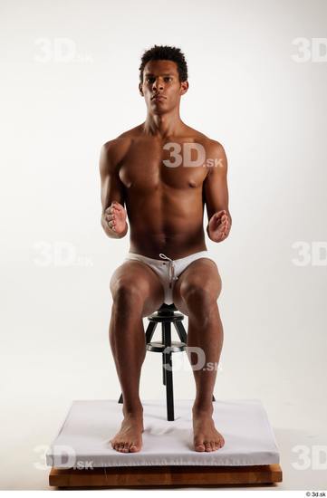 Whole Body Man Black Swimsuit Athletic Sitting Studio photo references