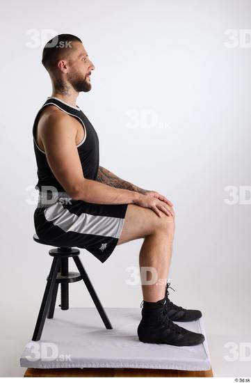 Whole Body Man White Sports Shorts Slim Athletic Sitting Top Studio photo references