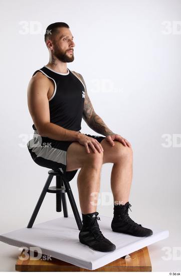 Whole Body Man White Sports Shorts Slim Athletic Sitting Top Studio photo references