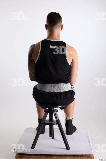 Whole Body Man White Sports Shorts Slim Athletic Sitting Top Studio photo references