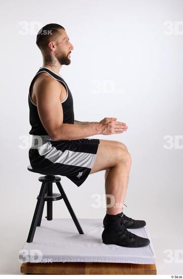 Whole Body Man White Sports Shorts Slim Athletic Sitting Top Studio photo references